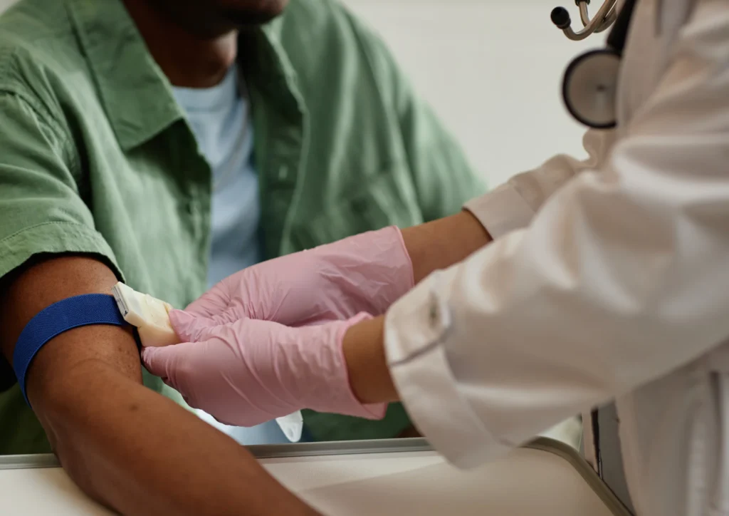 Doctor completing blood test for bowel health